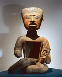 Seated figure with open stomach to receive offerings